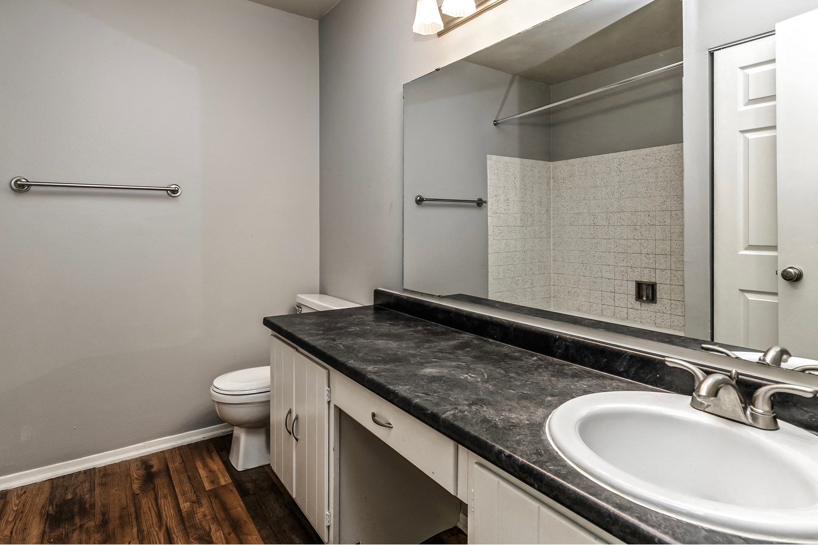 Remodeled bathroom with large vanity at Terrace Garden Townhomes
